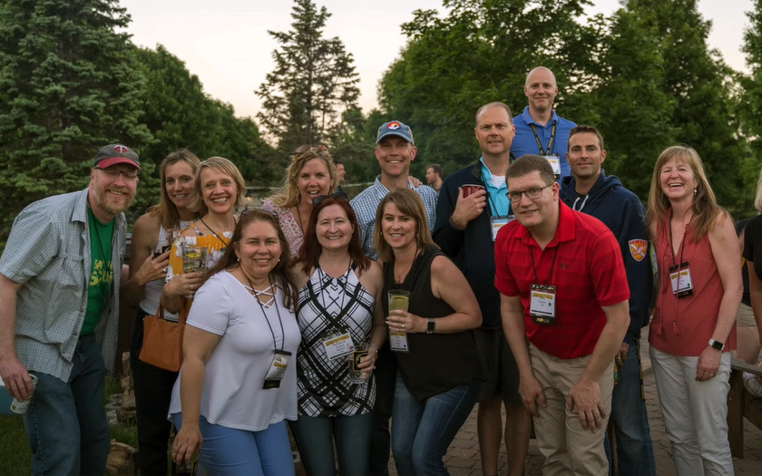 Group of Gustie alumns gathered together for a group photo
